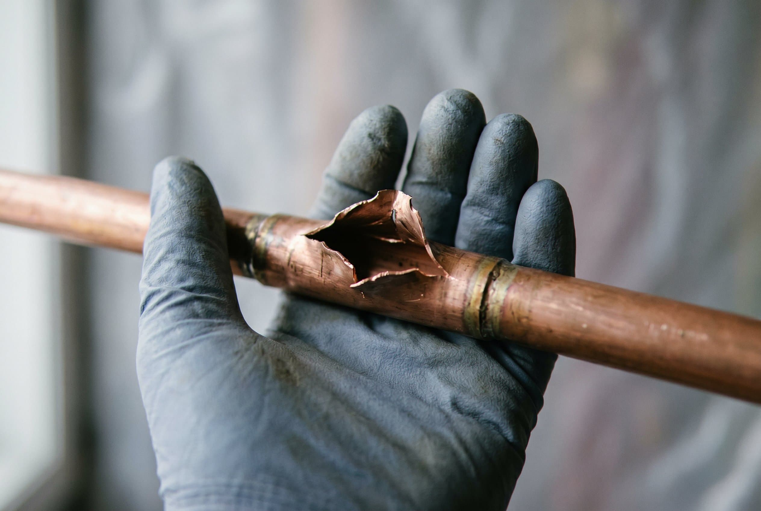 Copper pipe split from freeze damage.