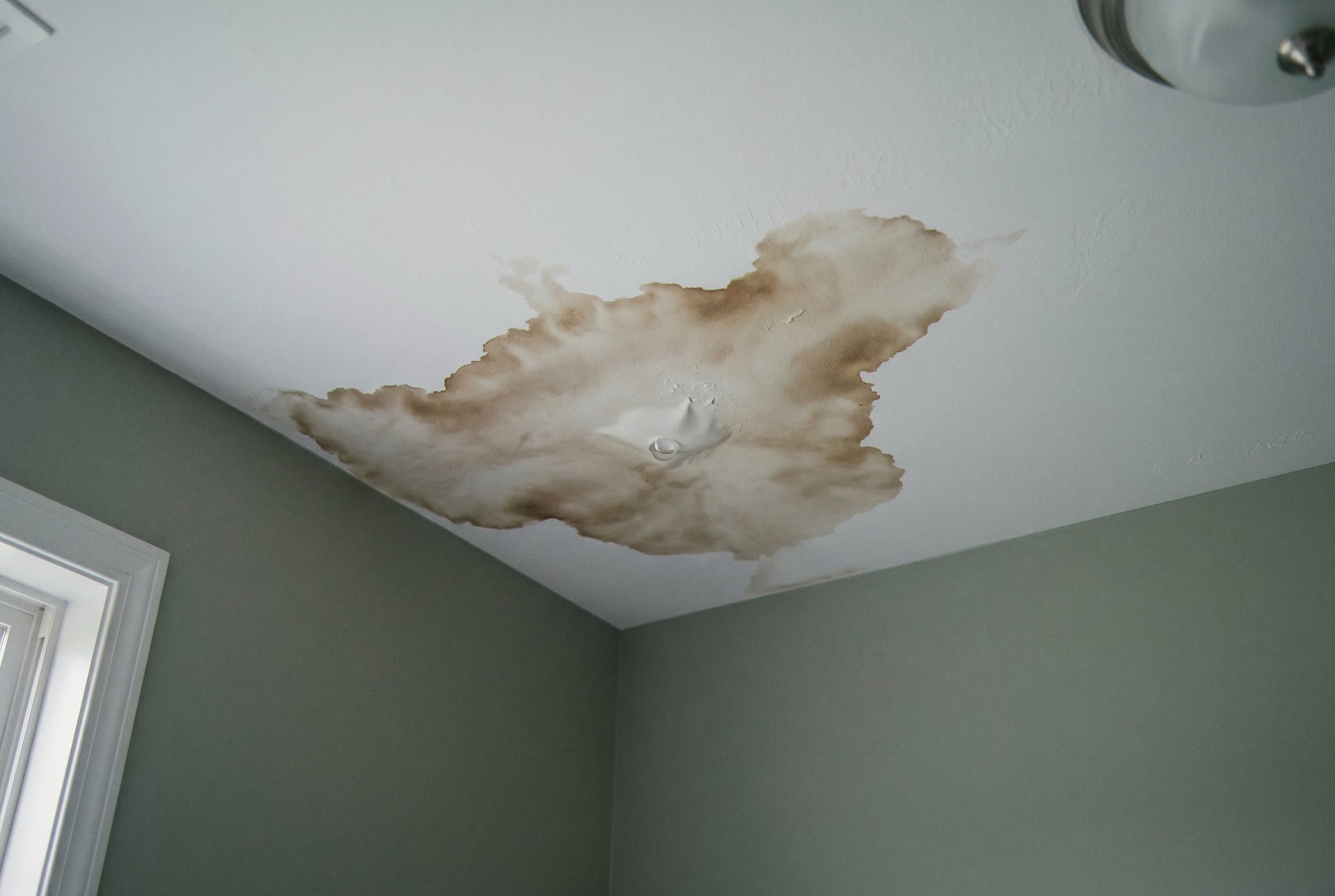 Soft drywall with visible water stains